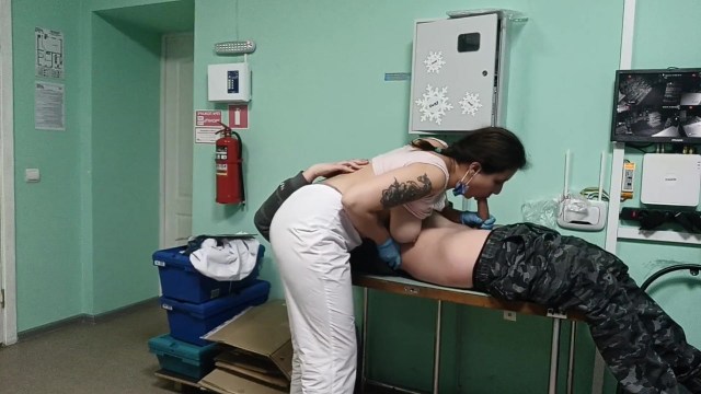A nurse with big boobs helps a patient cum